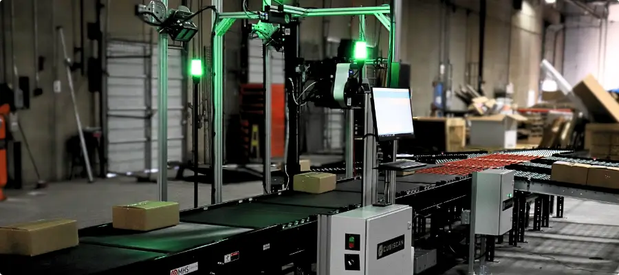 warehouse automation solutions section image man scanning a broom head for the purpose of slotting or warehouse pick and pack using dimensioning systems